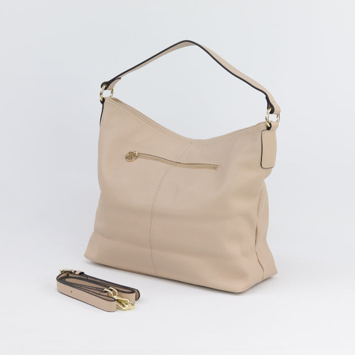 back view of amber hobo in nude with included leather crossbody strap#colour_nude