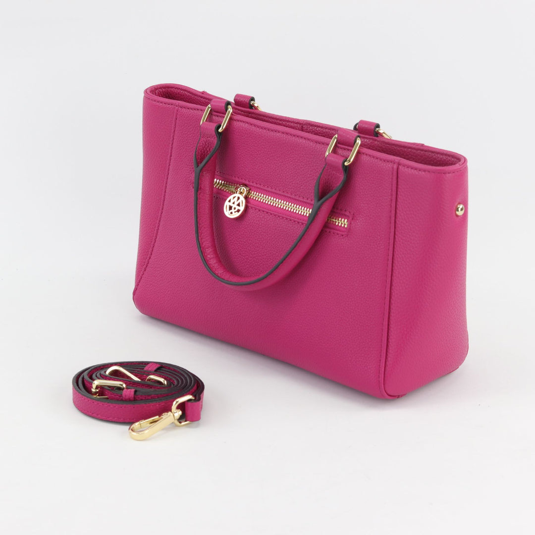 back view of the fuchsia anika handbag with gold zip and spare crossbody strap#colour_fuchsia