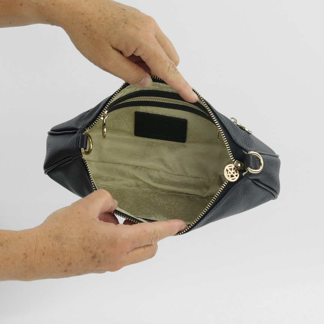 inside view of bronte handbag showing zip and pocket#colour_vanilla