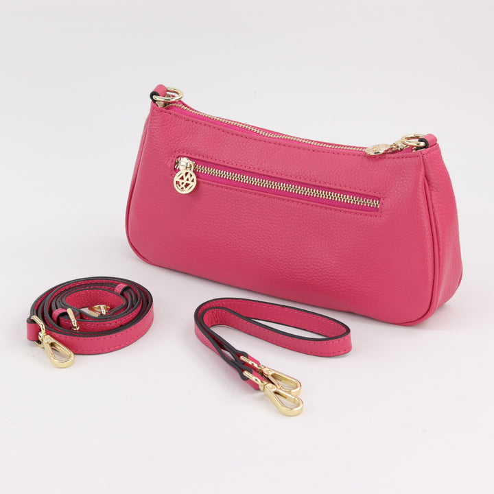 back view of fuchsia Bronte baguette bag with gold zip and spare straps #colour_hot-pink