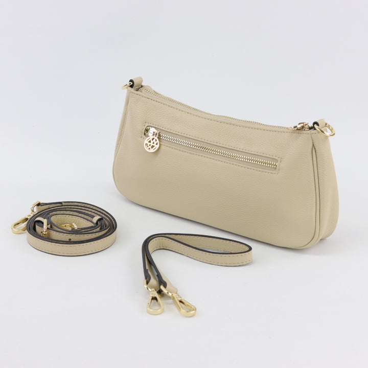 back view of bronte baguette bag in vanilla colour with gold zip and spare straps#colour_vanilla