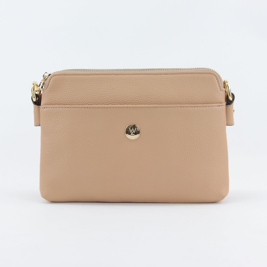 sand stone coloured leather bag with curved top and multiple compartments#colour_sandstone