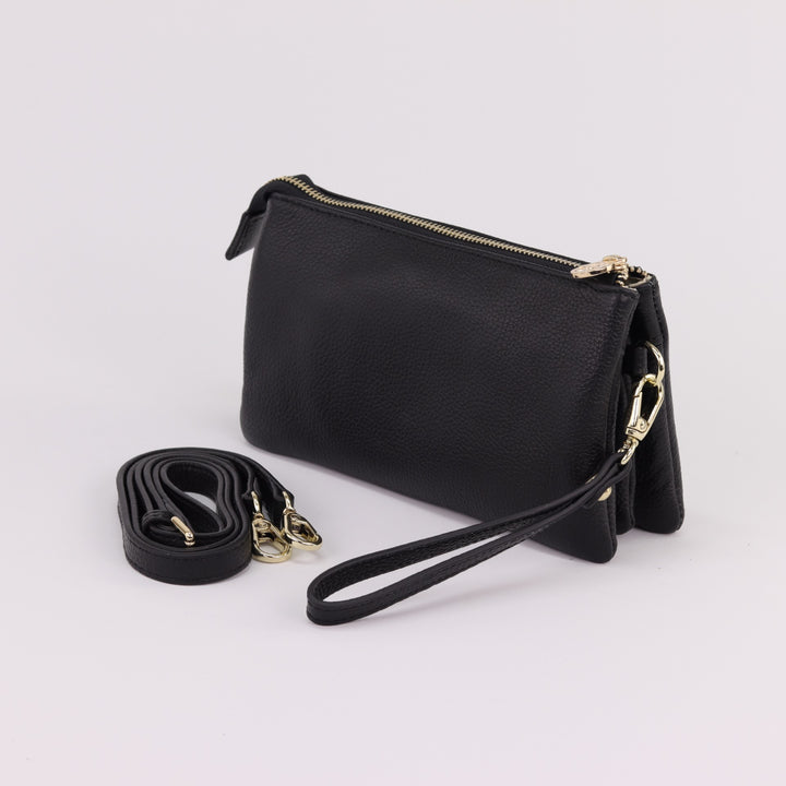 Back view of katie 5 compartment leather clutch with included wrist and long strap and gold hardware#colour_black