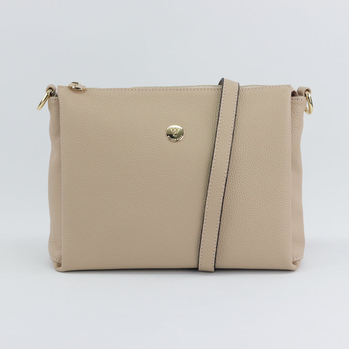 neutral nude coloured pebbled leather bag with gold hardware and included leather strap option#colour_nude