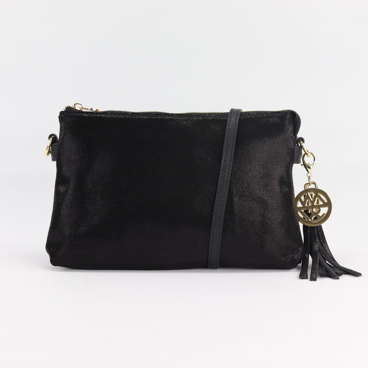 ruby clutch or crossbody handbag in black cosmos printed suede with long leather strap and gold tassel charm#colour_black-cosmos