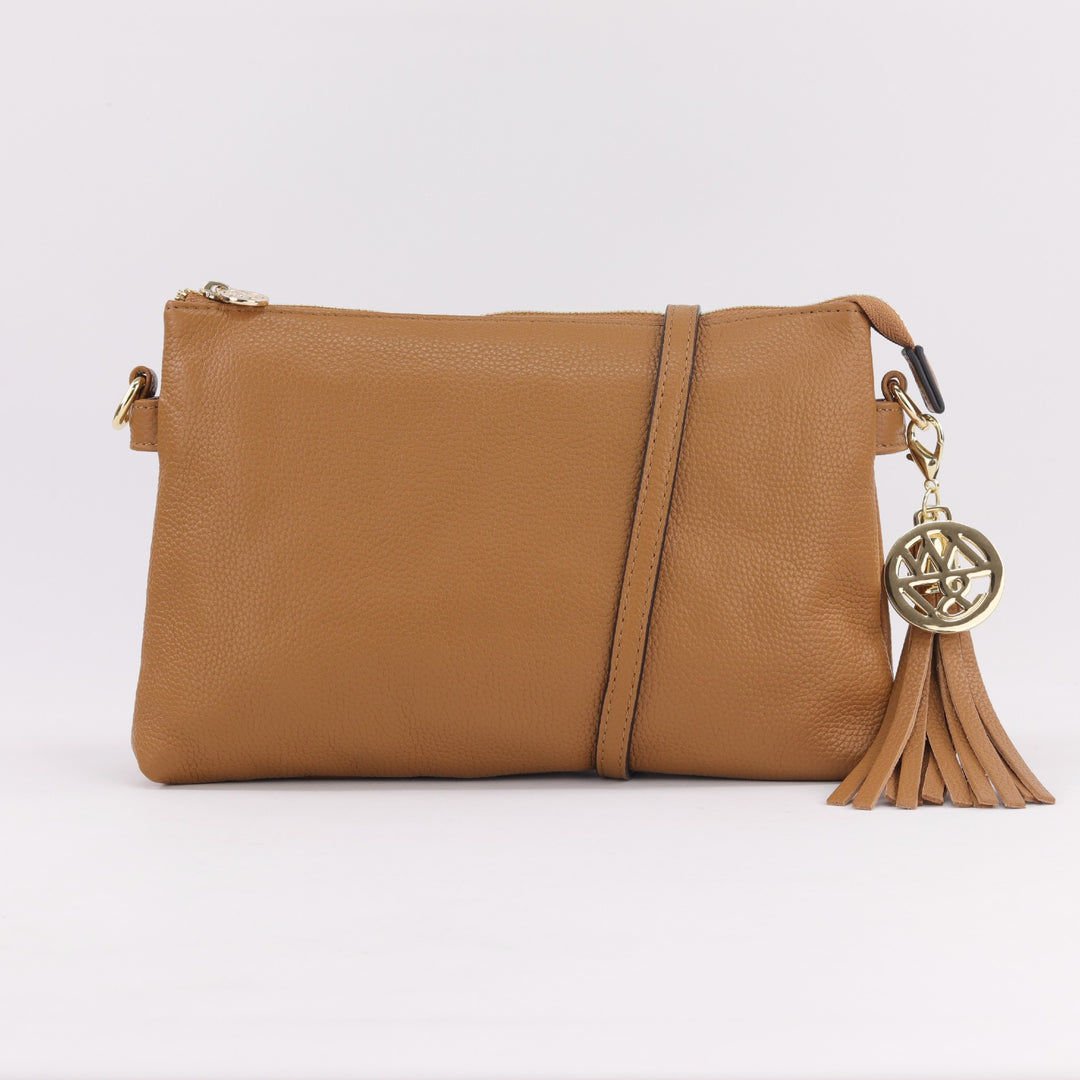 ruby leather handbag in caramel tan coloured pebbled leather with optional wrist or cross body strap and removable tassel#colour_caramel
