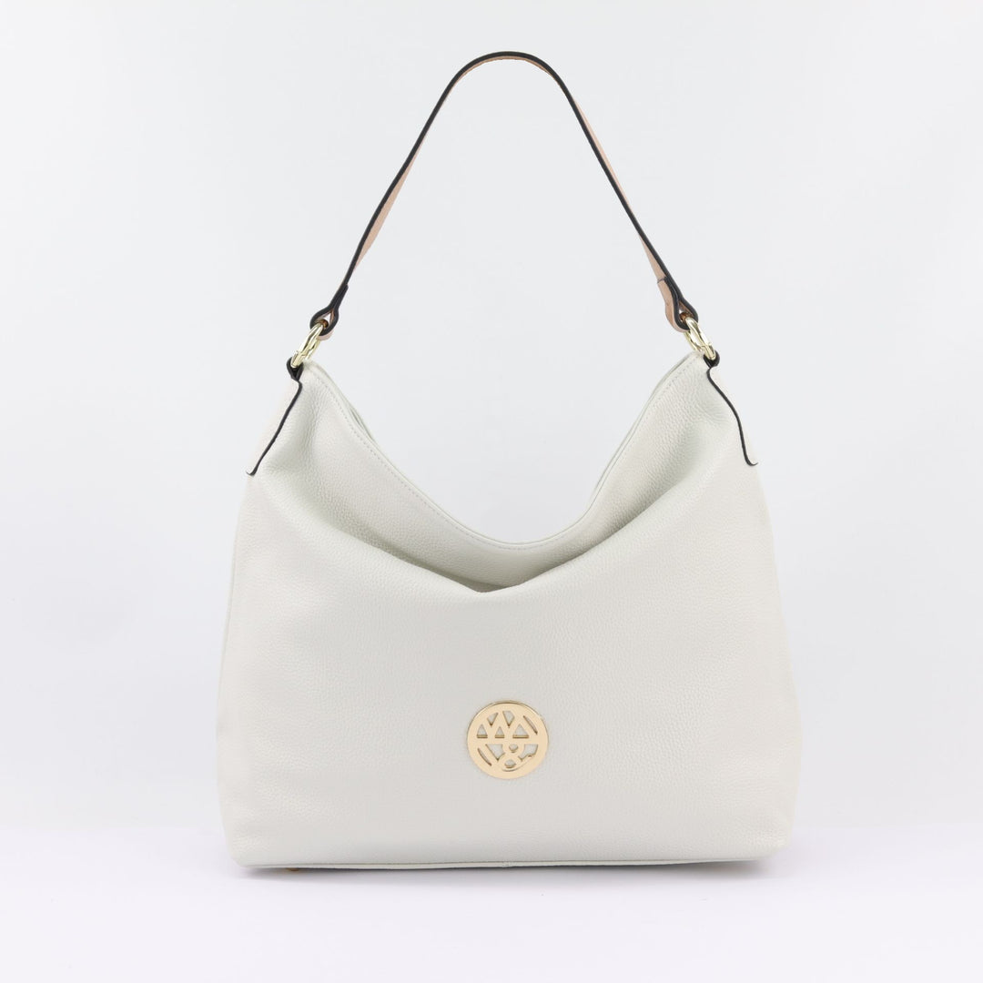 amber hobo handbag in white sandstone with large badge logo and wide shoulder strap#colour_white-sandstone
