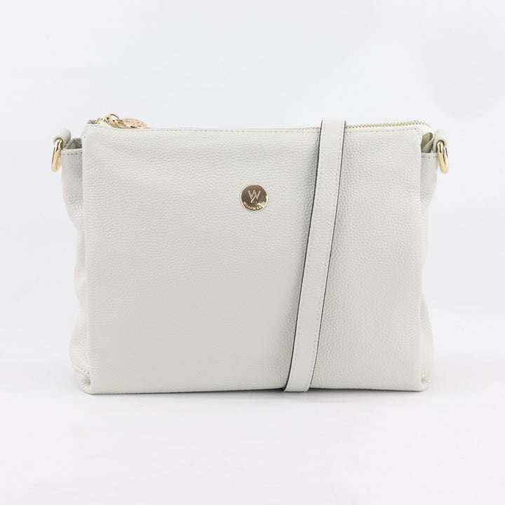 bright white coloured genuine leather handbag with long leather cross body strap and gold details#colour_white