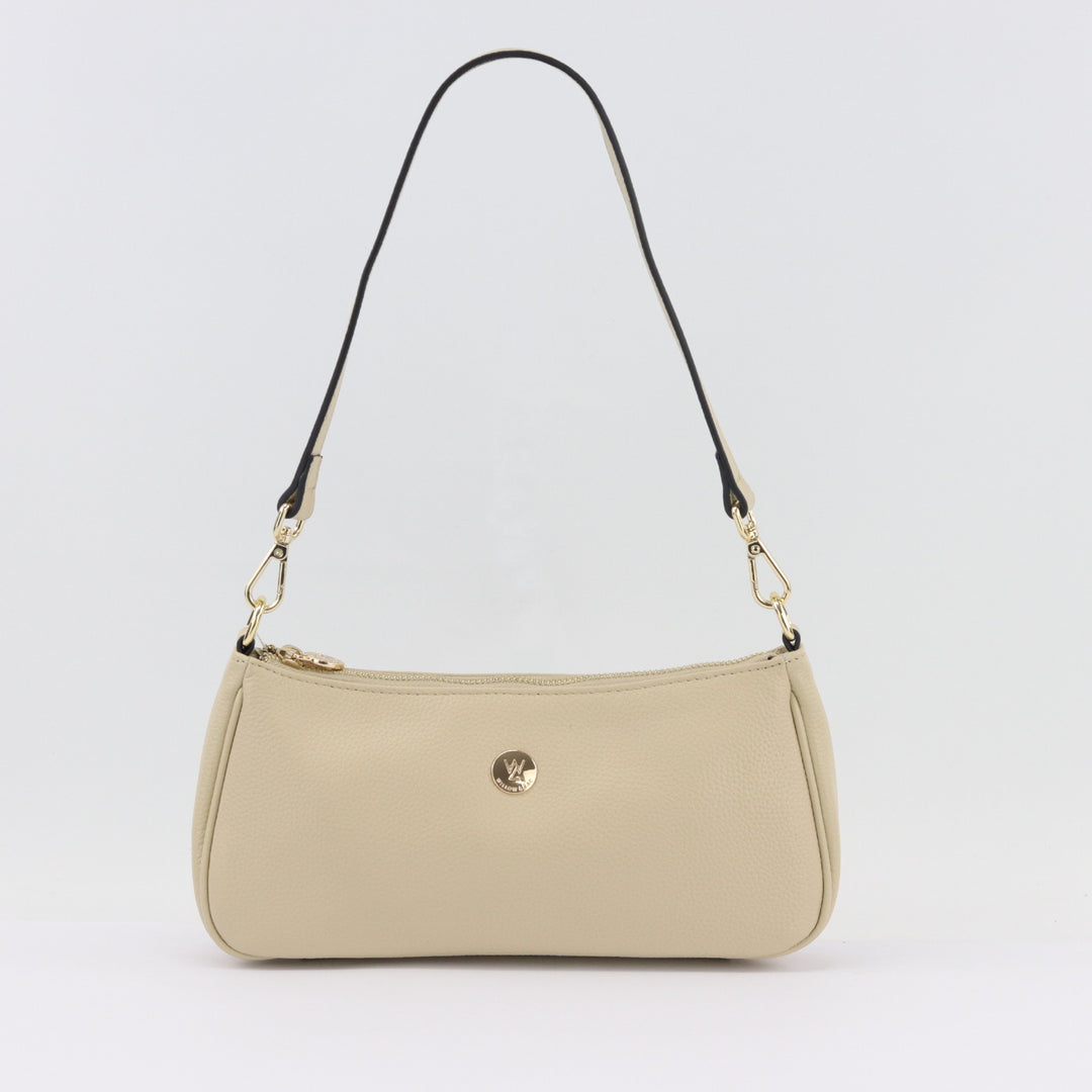 light neutral  cream coloured leather bag with removable straps and gold logo#colour_vanilla