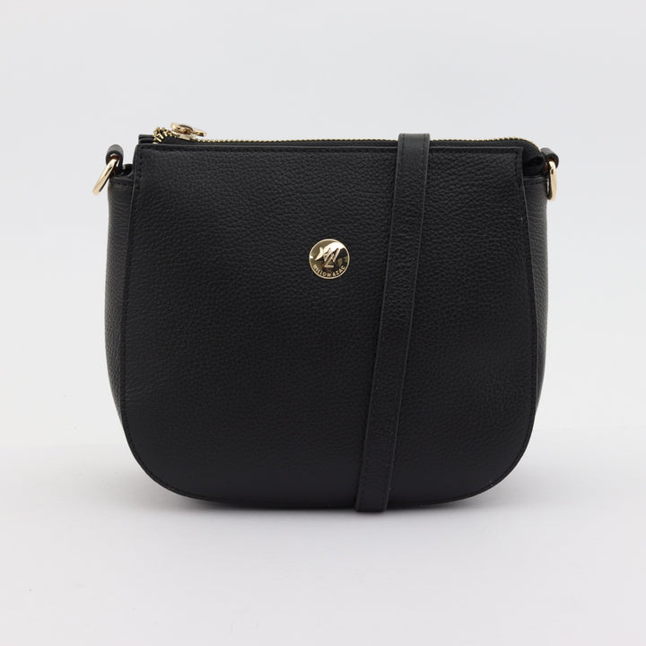 front view of clara in black pebbled leather with gold button logo#colour_black