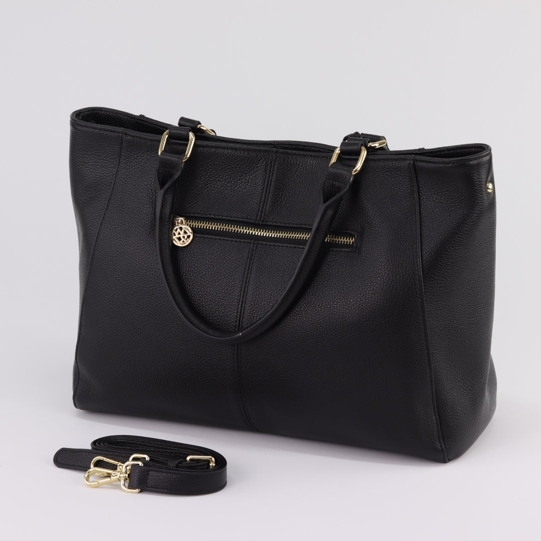 back view of corinne tote in black pebbled leather with gold zips and extra long strap#colour_black