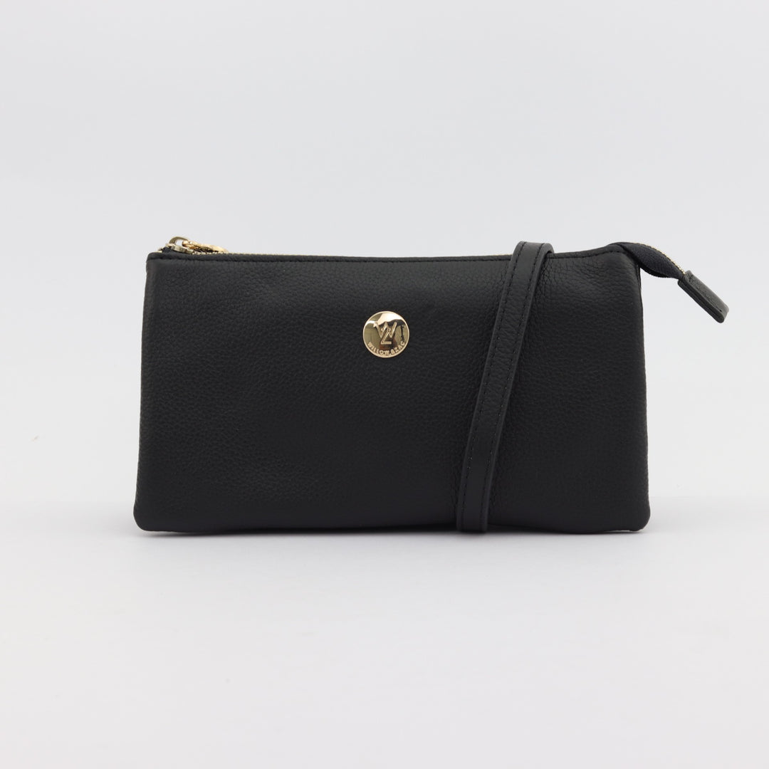 image of evie 5 pocket leather clutch or wallet in black pebbled leather with gold button logo#colour_black