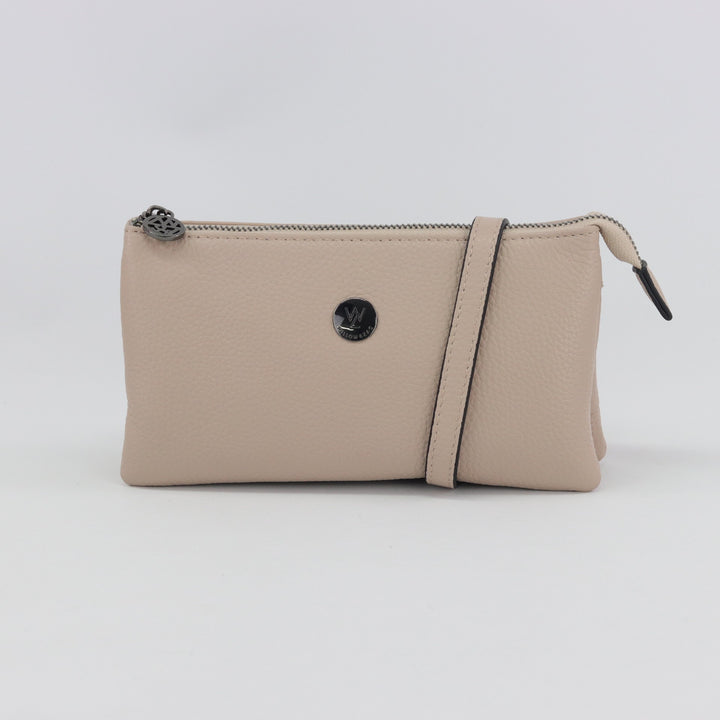 neutral nude coloured leather clutch wallet with black gunmetal#colour_nude-black-hardware