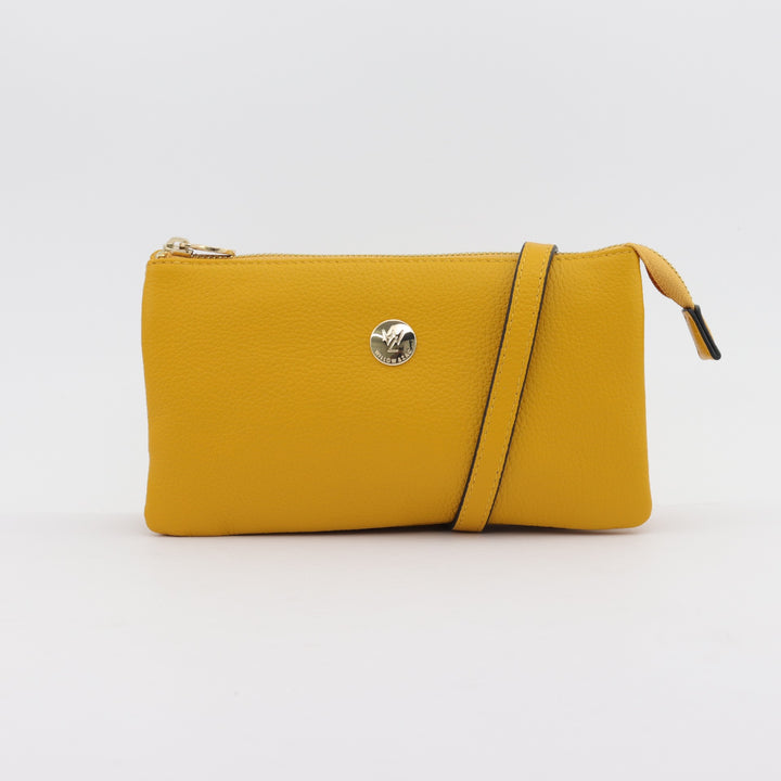 evie leather crossbody or clutch in gold yellow pebbled leather on white studio background#colour_saffron