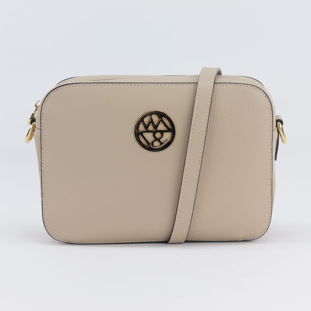 neutral nude leather box style bag with gold badge logo#colour_nude