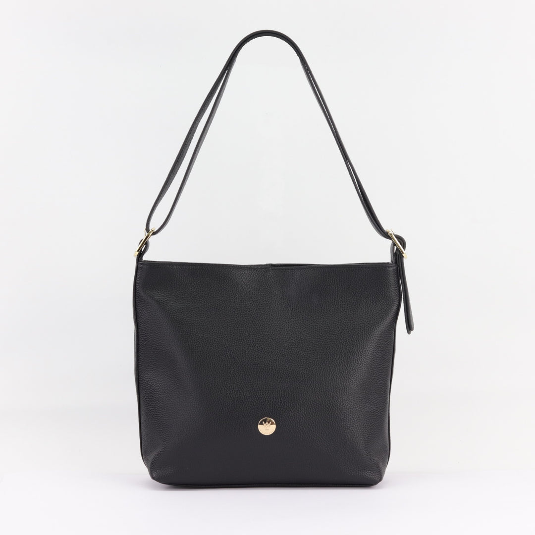 studio image of black leather bag with doubled over handle and gold buckle and small button logo#colour_black