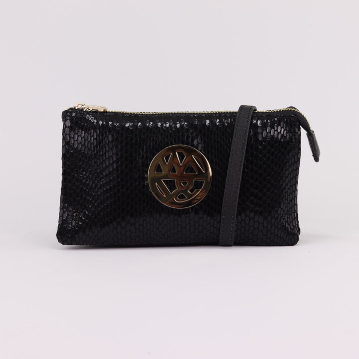 soft wallet or small clutch in jet black printed suede with scaley pattern, large gold logo and zips#colour_jet
