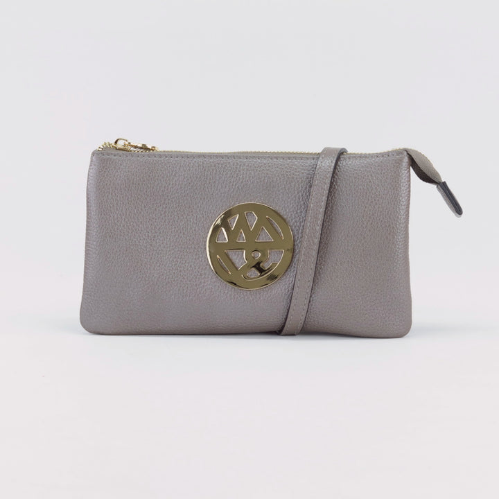 shimmery pewter brown coloured leather wallet clutch with long crossbody strap and large gold badge logo and zip#colour_pewter