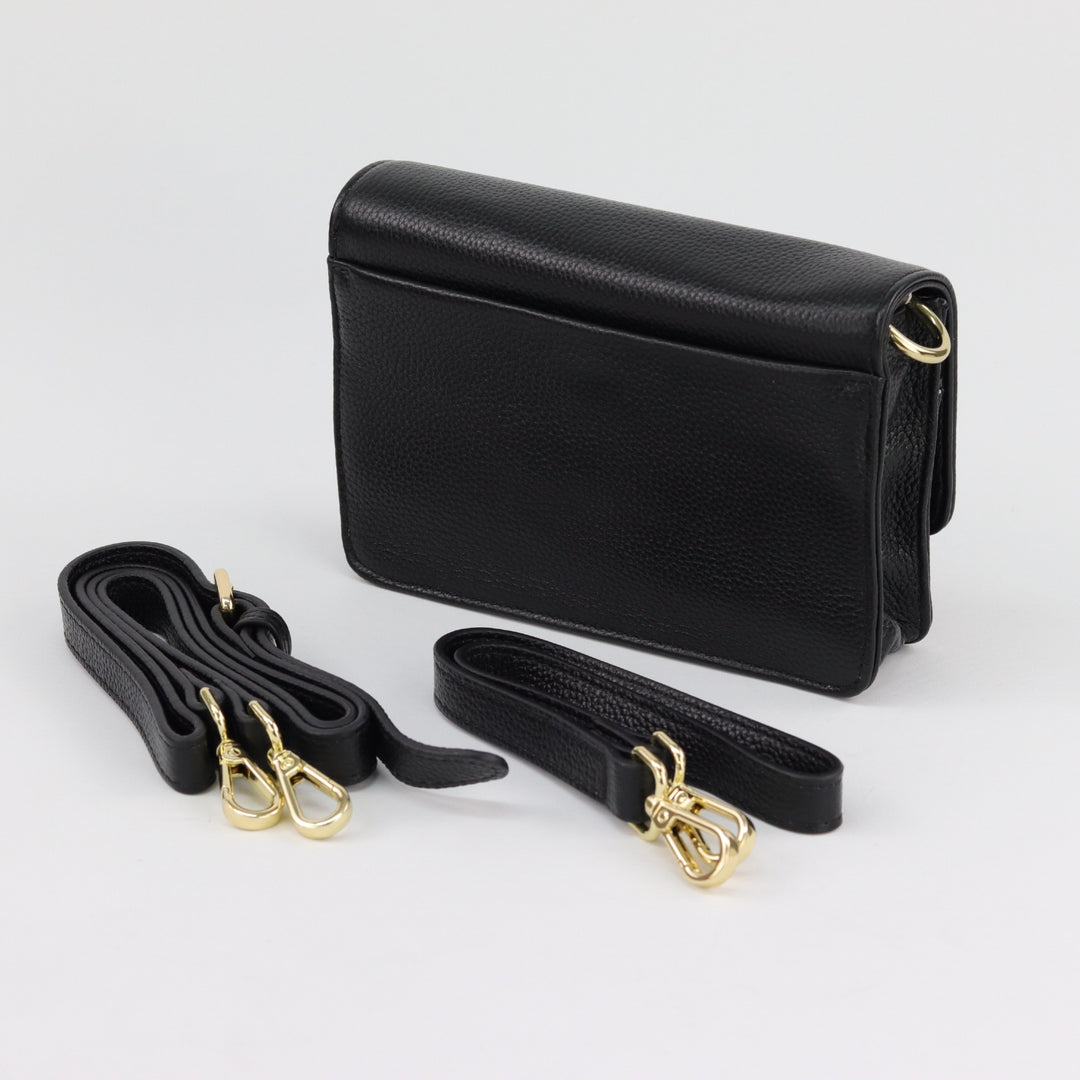 back view of lily compact clutch in black pebbled leather with included shoulder and crossbody leather straps#colour_black