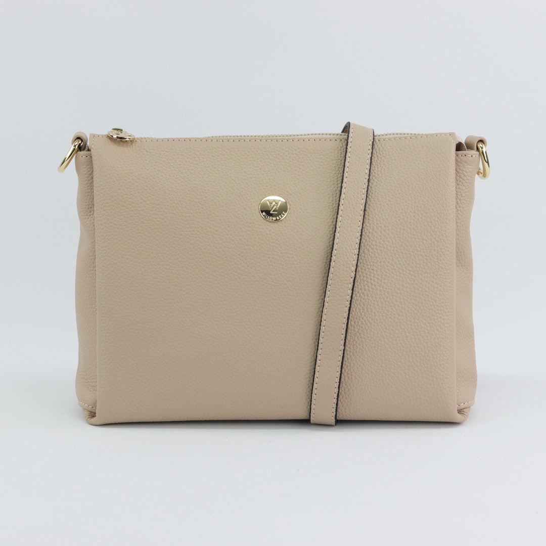 neutral nude coloured pebbled leather bag with gold hardware and included leather strap option#colour_nude
