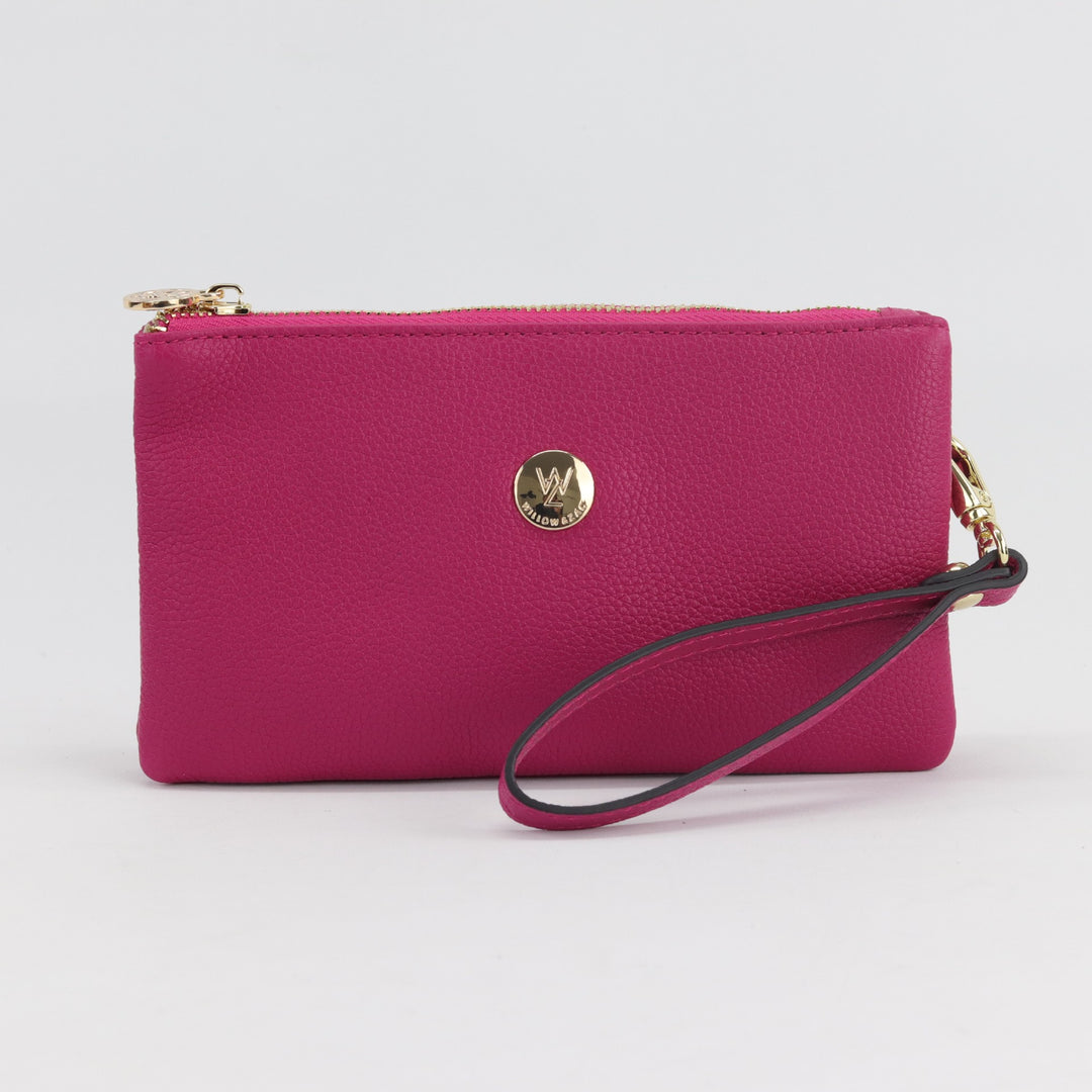 bright pink fuchsia pebbled leather wallet or clutch with gold zip and button logo #colour_fuchsia