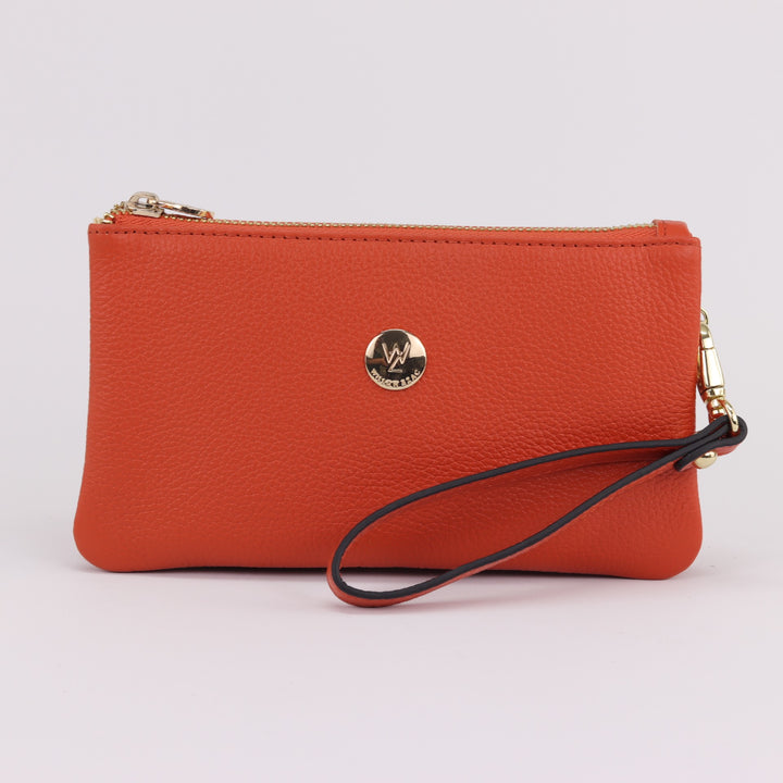 bright orange coloured pebbled leather clutch with wrist strap and gold hardware on white background#colour_orange