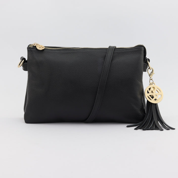 ruby leather handbag in black with black tassel and gold badge logo#colour_black