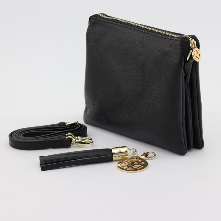 back and side view of tara handbag showing included straps and tassel#colour_black